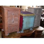 A painted three drawer bedside chest, a six drawer chest and a painted stool