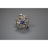 A white metal, sapphire and diamond set large cluster ring, size M, gross 8.9 grams.CONDITION: At