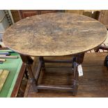 An 18th century oak oval centre table, width 72cm, depth 56cm, height 62cm