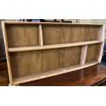 An Ercol light elm plate rack, width 106cm, height 49cm