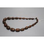 A rhinoceros horn graduated bead necklace, late 19th/early 20th century, length 55cm