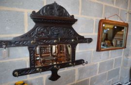 A Victorian inlaid rosewood overmantel mirror, W.84cm, together with a later Flemish carved oak