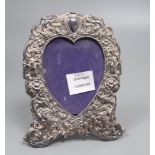 A 1970's Victorian style silver photograph frame with a heart shaped aperture, 19.4cm.