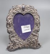 A 1970's Victorian style silver photograph frame with a heart shaped aperture, 19.4cm.
