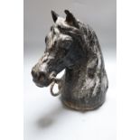 A cast iron horse tethering post, c.1900, height 28cm, of horse head form
