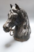 A cast iron horse tethering post, c.1900, height 28cm, of horse head form