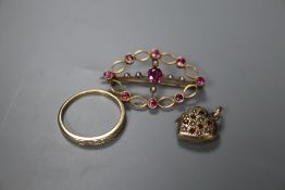 A yellow metal, garnet? and seed pearl set oval brooch, 35mm, a 10k and diamond set half hoop ring