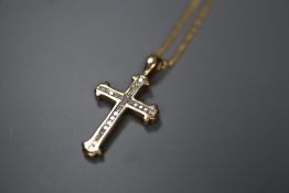 A 9k and diamond set gold cross pendant, on a 375 chain, pendant overall 31mm, gross 5.2 grams.