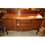 A 1920's Chippendale revival mahogany bow fronted sideboard, W.152cm, D.60cm, H.115cm