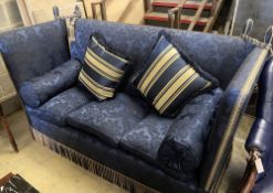 A three seater Knoll settee upholstered in dark blue damask, width 182cm, depth 78cm, height 114cm
