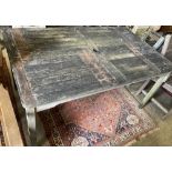 A weathered teak garden table, width 150cm, depth 90cm