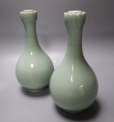 A pair of Chinese celadon glazed garlic neck vases, Yongzheng mark but 20th century, height 23cm