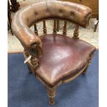 A Victorian walnut tub framed library chair upholstered in faded burgundy leather, width 70cm, depth