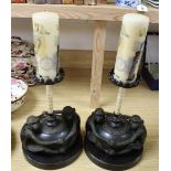 A pair of bronze and bone monkey candlesticks, height 32cm