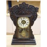 An American dark oak mantel clock, with bell striking movement, height 56cm