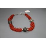 An Eastern white metal and multi strand coral bead necklace, 65cm.