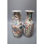 A pair of Chinese famille rose 'warrior' vases, 19th century, height 26cm