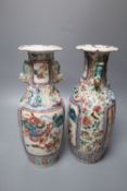 A pair of Chinese famille rose 'warrior' vases, 19th century, height 26cm