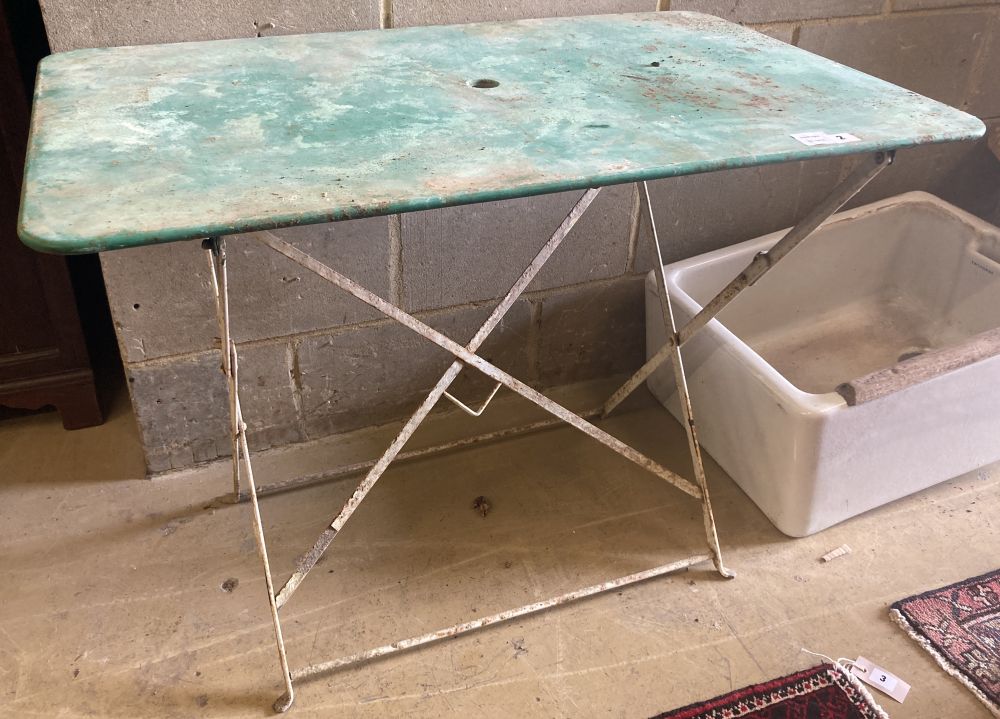 An early 20th century French folding slatted wood and iron garden table, c.1900, width 97cm depth