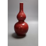 A Chinese sang-de-boeuf glazed double gourd vase, height 23cm