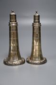 A pair of Victorian novelty silver pepperettes modelled as lighthouses, inscribed on each base '