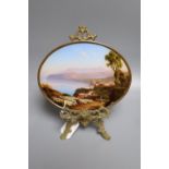 A Neapolitan oval reverse painting on glass of the Bay of Naples, miniature width 20cm, with a small