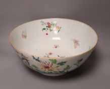 An 18th century Chinese porcelain punch bowl, brightly painted in enamels, 30cm