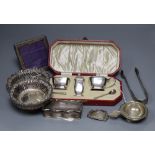 A cased silver condiment set, two pierced bon bon dishes, a silver box, a photograph frame and a
