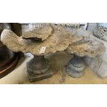 Two reconstituted stone bird baths (one in need of repair), largest diameter 65cm