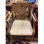 A pair of Edwardian Sheraton revival painted satinwood caned back elbow chairs, width 53cm, height