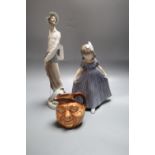 A Royal Copenhagen figure of a girl, a Lladro soldier and a Doulton John Barleycorn jug, tallest