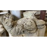 Three reconstituted stone garden ornaments: cat, hedgehog and a boot, longest 36cm