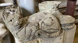 Three reconstituted stone garden ornaments: cat, hedgehog and a boot, longest 36cm