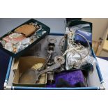 A box of assorted costume jewellery, silver napkin rings, brushes etc.