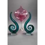 A ruby 'Jack in the Pulpit' glass vase, height 32cm and a pair of green glass scrolls