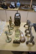 A Dutch brass candle sconce, a pair of Victorian Arts & Crafts brass fire dogs, a lantern clock,