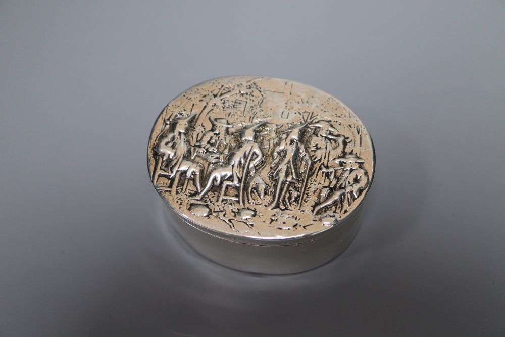 A George III oval silver box and cover, the lid embossed with imbibers, London, 1797, 74mm, 119