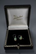 A pair of white metal and pear shaped opal and diamond set drop earrings, opal 12mm, gross 2.6