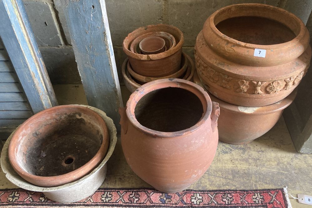 Thirteen terracotta and stone garden urns, c.1900, largest diameter 38cm