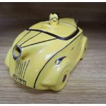 A Sadlers yellow glazed racing car teapot and cover, with silver lustre detail, registration OKT42