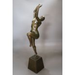 H. Calot. A bronze of a nude dancer (arm a.f.), height 53cm