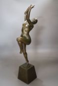 H. Calot. A bronze of a nude dancer (arm a.f.), height 53cm