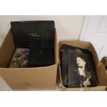 Two boxes of photo albums and loose family photos