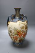 A Royal Worcester porcelain two-handled vase, the bulbous body painted with fruit and foliage,
