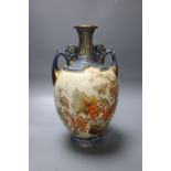 A Royal Worcester porcelain two-handled vase, the bulbous body painted with fruit and foliage,