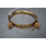 A 9ct gold hinged bracelet and a pair of 9ct gold earrings, gross 11.5 grams.