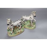 A pair of Victorian Staffordshire zebra, width 11cm