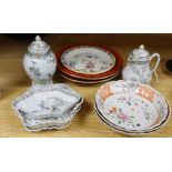 An 18th century Chinese export part tea set including a spoon tray, a teapot stand and two orange