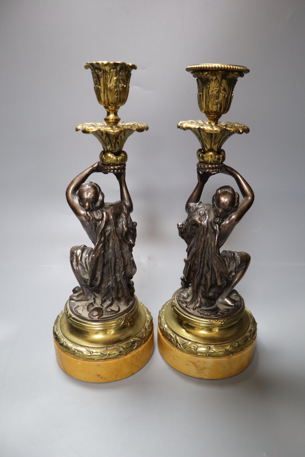 A pair of early 19th century gilt metal and bronze figural candlesticks, on marble plinths, height - Image 2 of 2