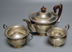 A George V silver three-piece tea service, by Harrod's Ltd, Birmingham, 1932, gross 20.5 oz.